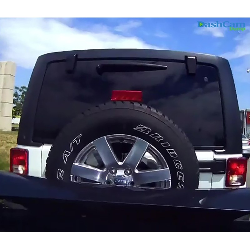 Jeep driver drives backward